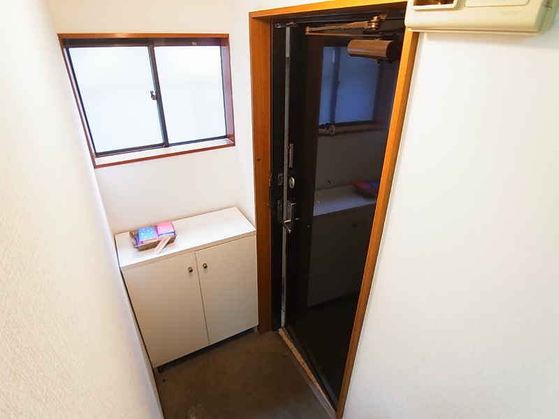 ジュネパレスコスギ 玄関