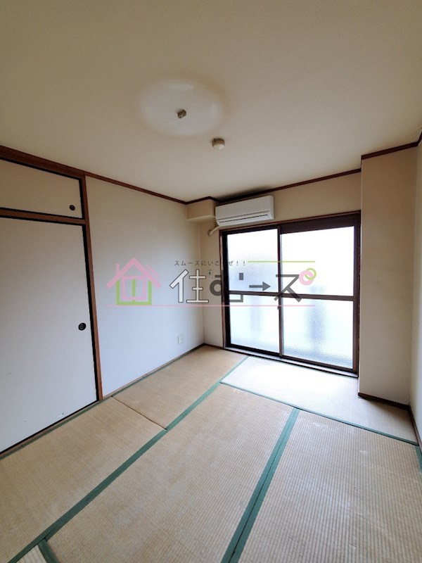 豊里丸富マンション ベッドルーム