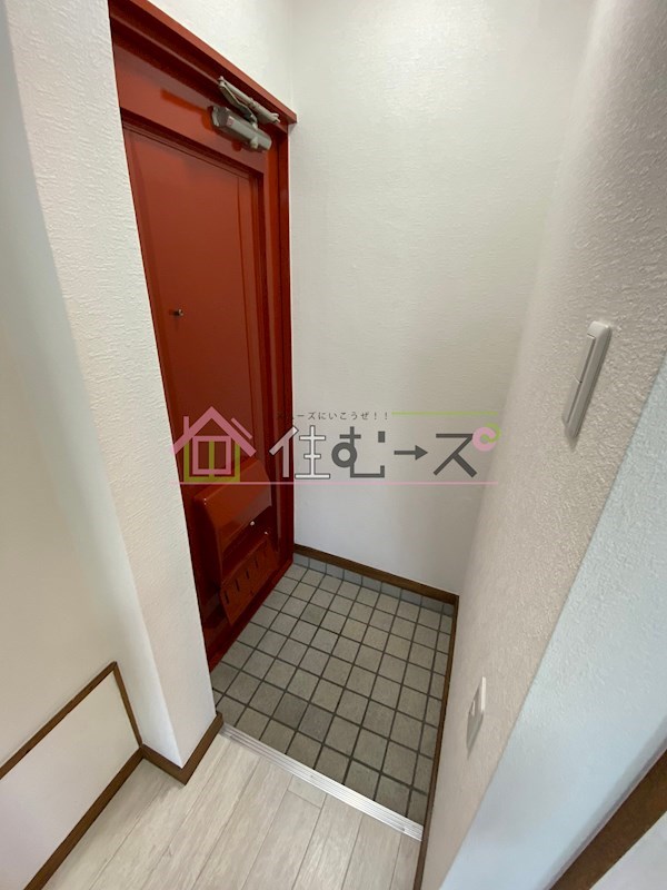 プレジール平野 玄関