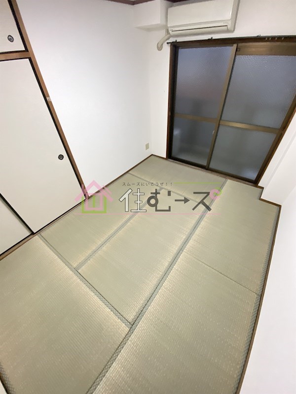 豊里丸富マンション ベッドルーム