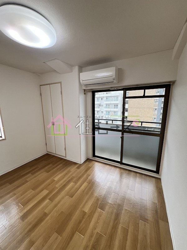 西三国共栄マンション ベッドルーム