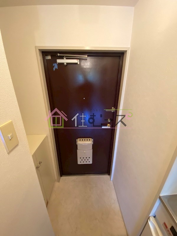 リアライズ西淡路 玄関