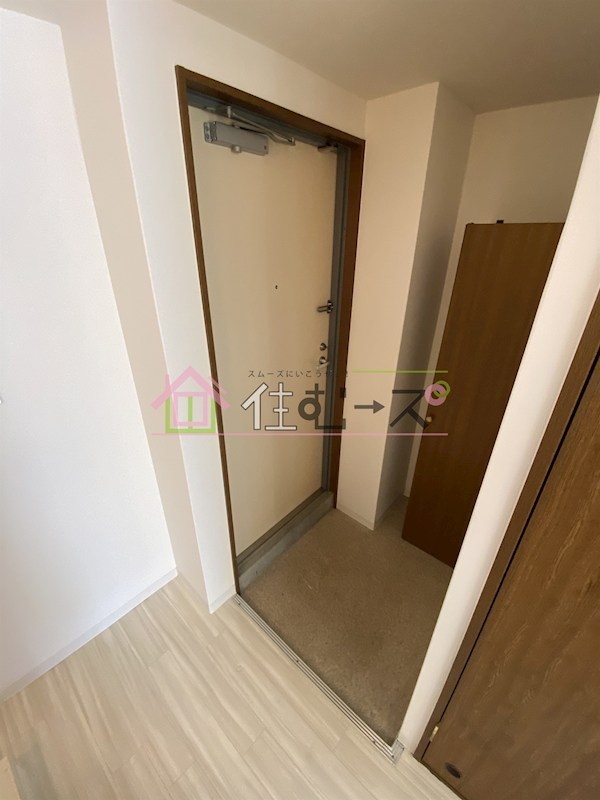 プレジール福島 玄関