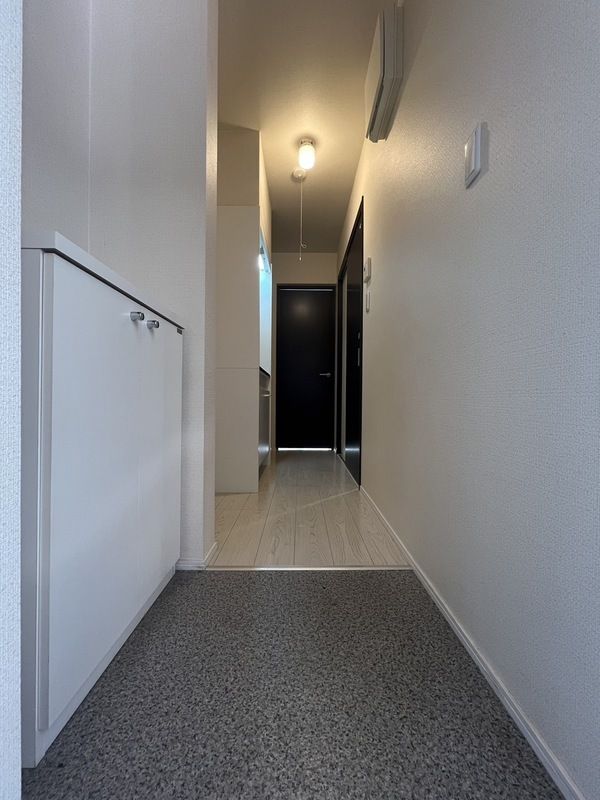 コンポジット相原 玄関