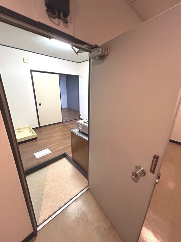 クロノス根木内 玄関