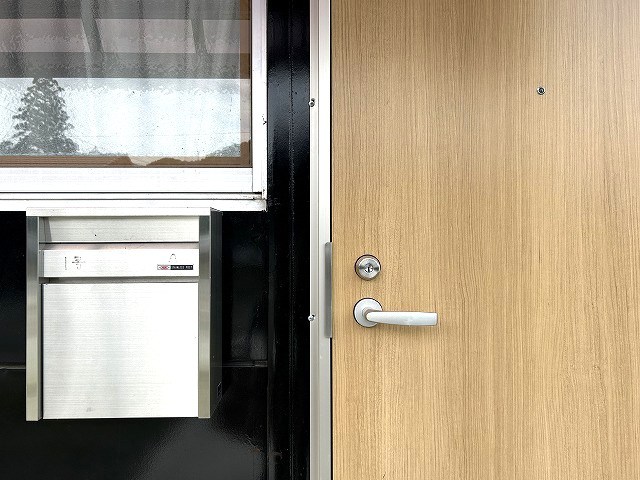 グランドシティ村石1号 玄関