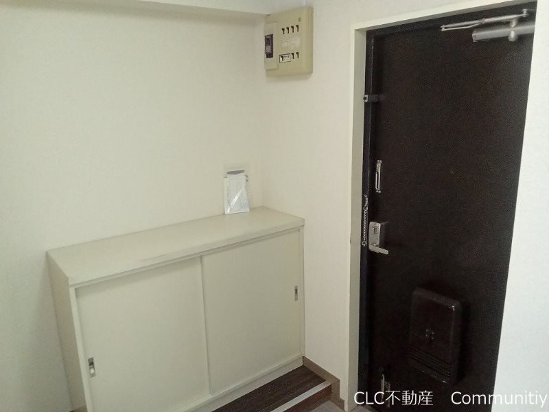 タウンコート丸義 玄関