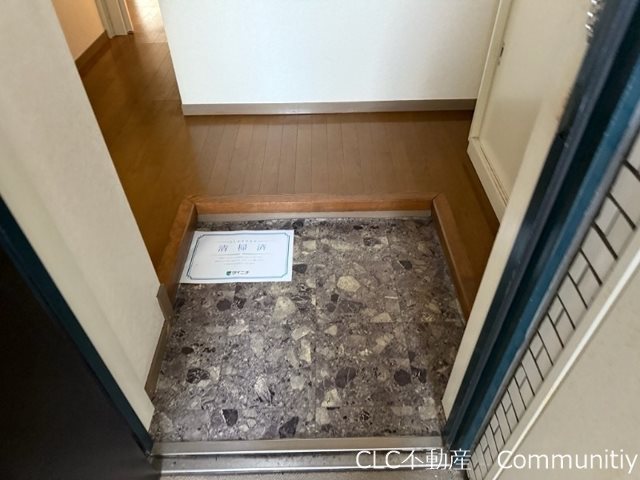 タウンコート丸義 玄関