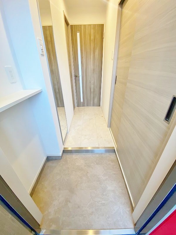 アクシオ三萩野Ⅱ 玄関