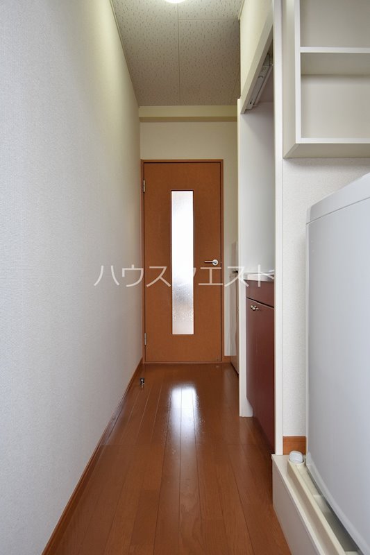 プレジール春日 玄関