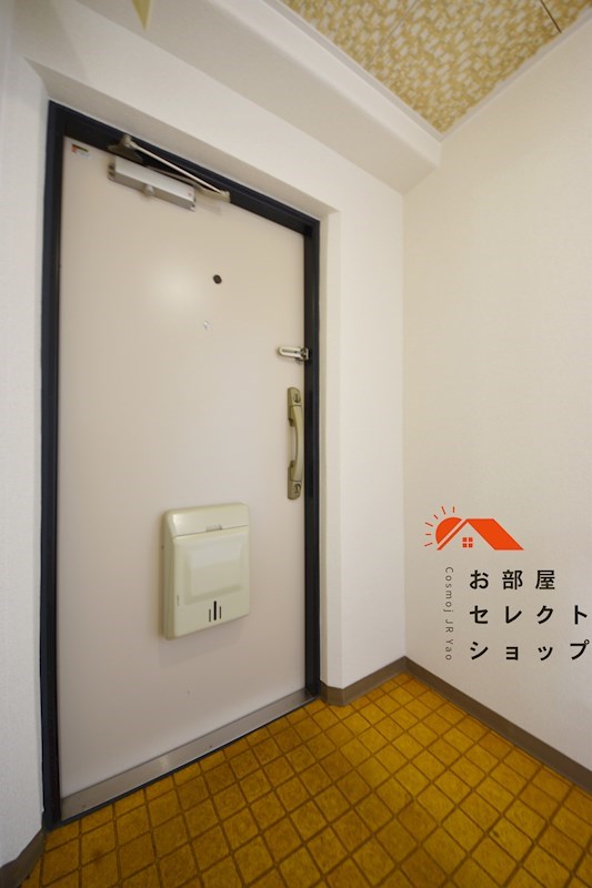 コープ野村恩智B棟  玄関