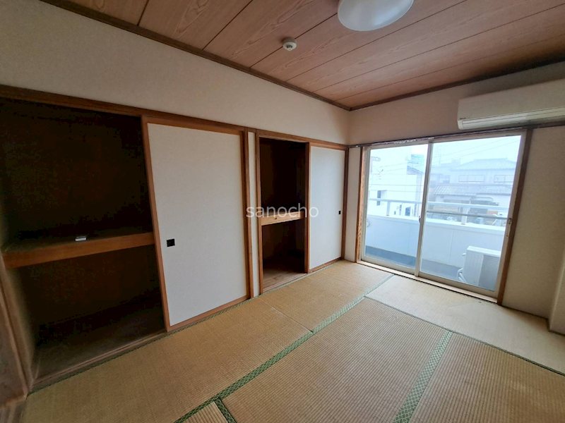 丸長コーポカラコ ベッドルーム