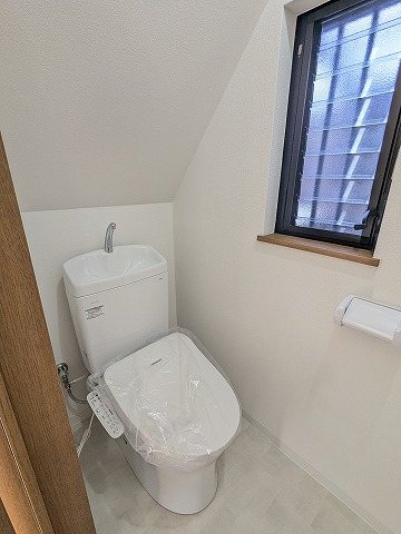 大阪府枚方市松丘町 内観写真（トイレ）